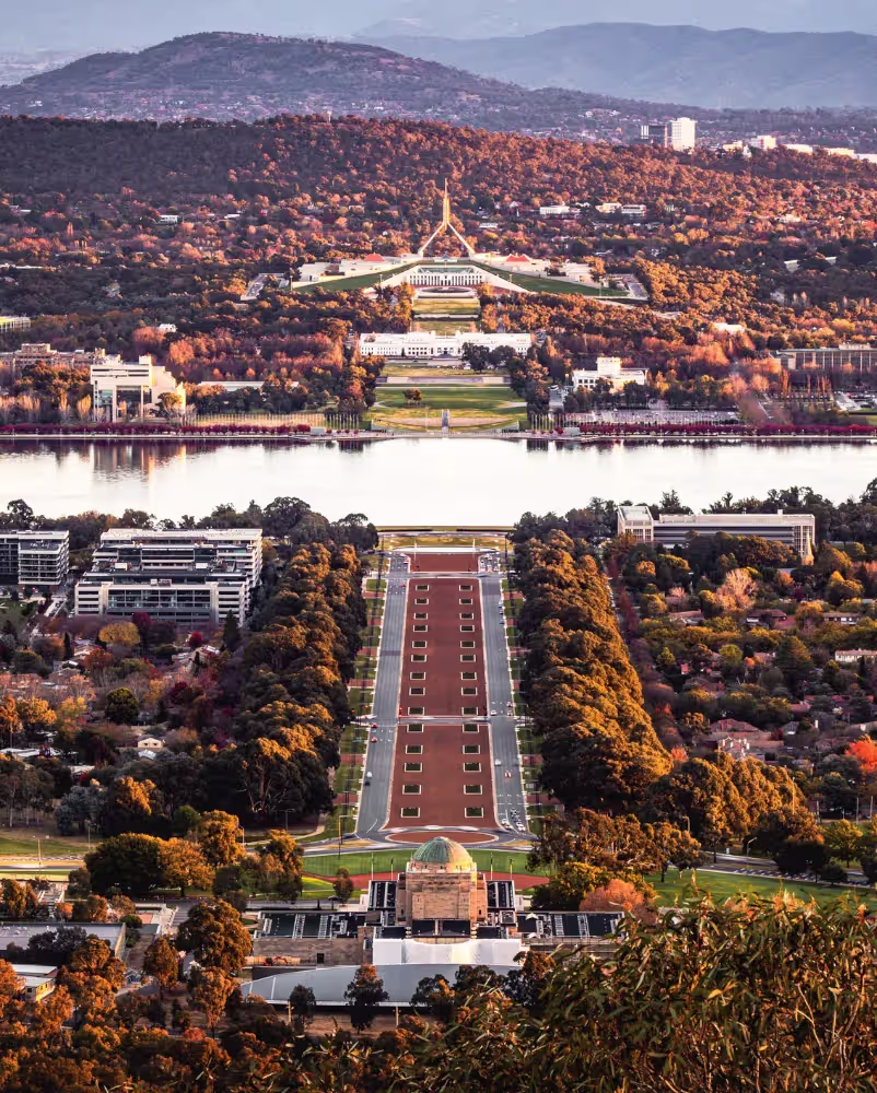 Aerial view of Parliament House in Canberra symbolising government policy advisory, economic research and public sector consulting in Australia.
